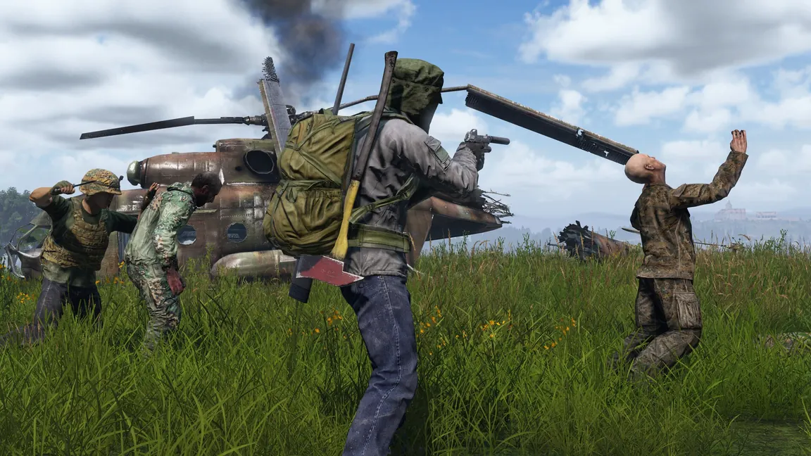 Survivors fighting infected beside a crashed military helicopter wreck