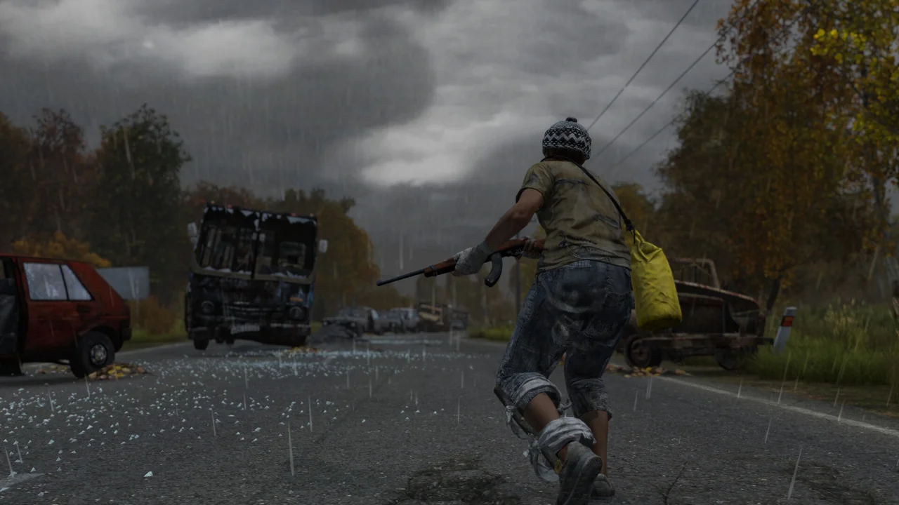 Survivor sprinting down a rain-soaked DayZ road past a wrecked truck and abandoned cars